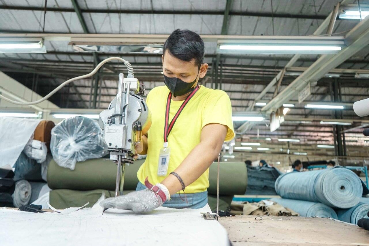 Fabric cutting in progress at the Sandang Asia factory
